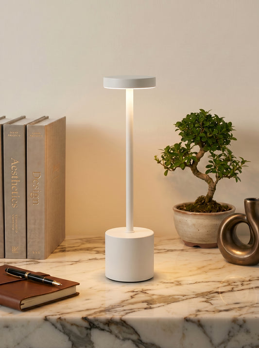 White Egret Lamp on a white marble shelf with a bonsai tree, books and a leather notebook