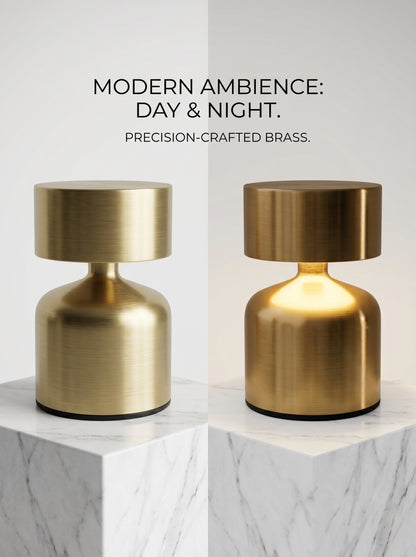 Two Gold Pipit Lamps on marble, one off and one glowing, showing the day and night look