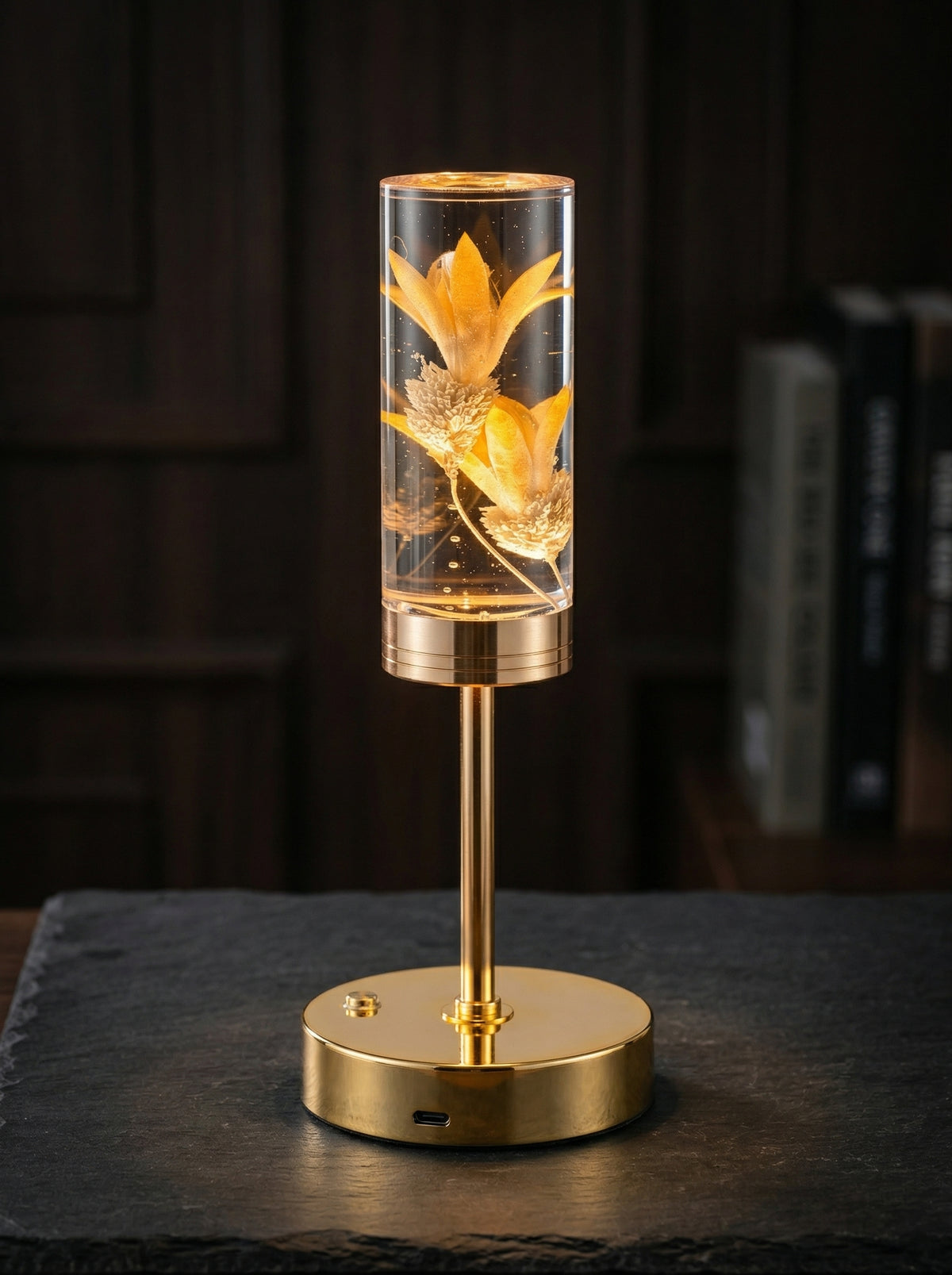 Gold and Yellow Phoenix Lamp glowing against a dark background, yellow flowers lit inside