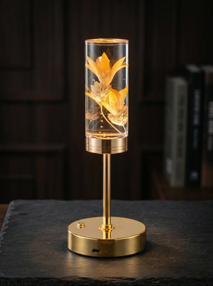 Gold and Yellow Phoenix Lamp glowing against a dark background, yellow flowers lit inside