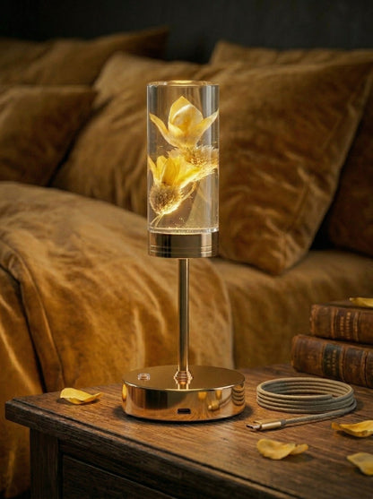 Gold and Yellow Phoenix Lamp on a bedside table with mustard bedding and scattered petals