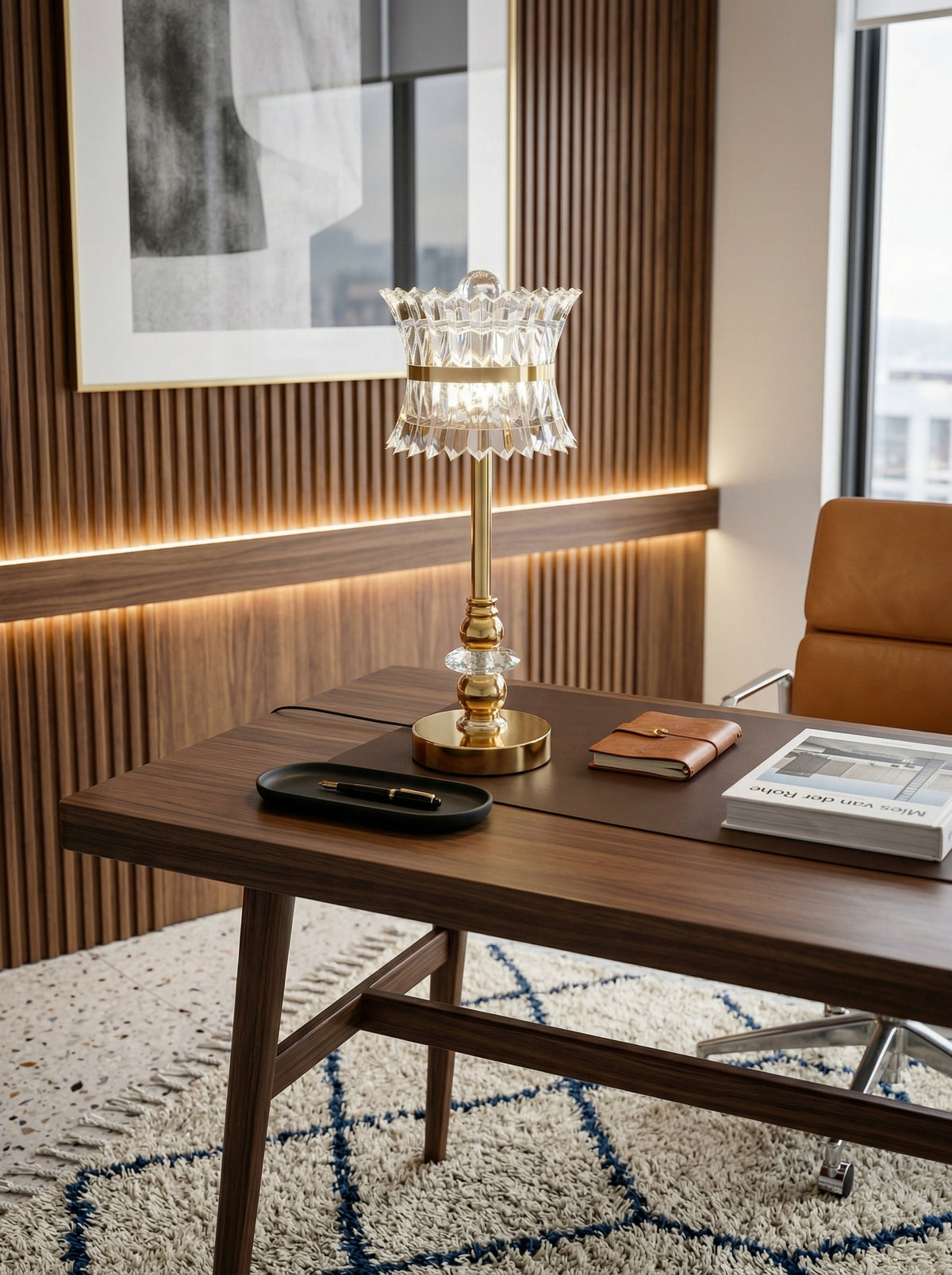 Gold Quetzal Lamp on a walnut desk in a home office with a patterned rug