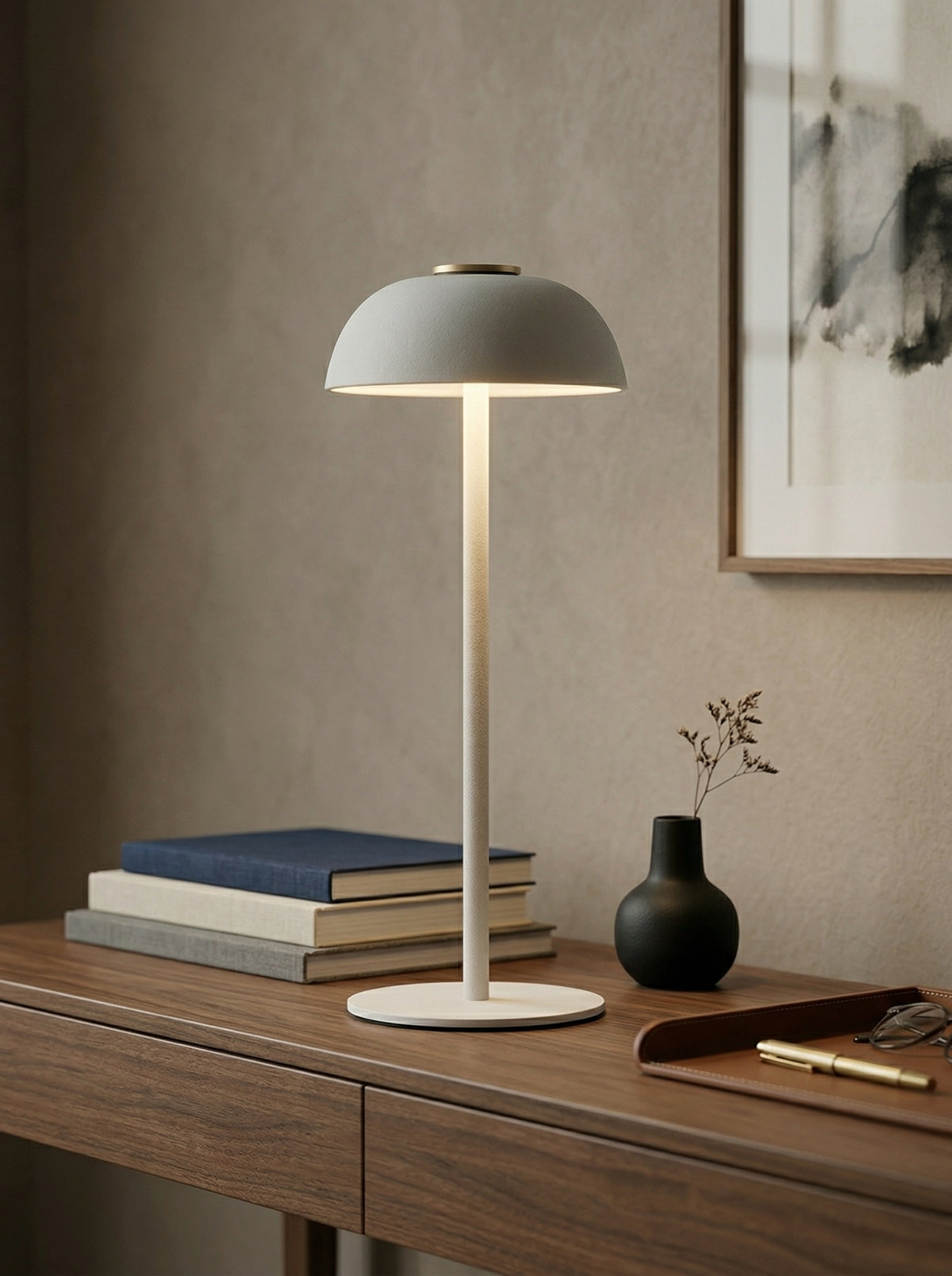 White Swan Lamp on a wooden console with stacked books, a black vase and a pen
